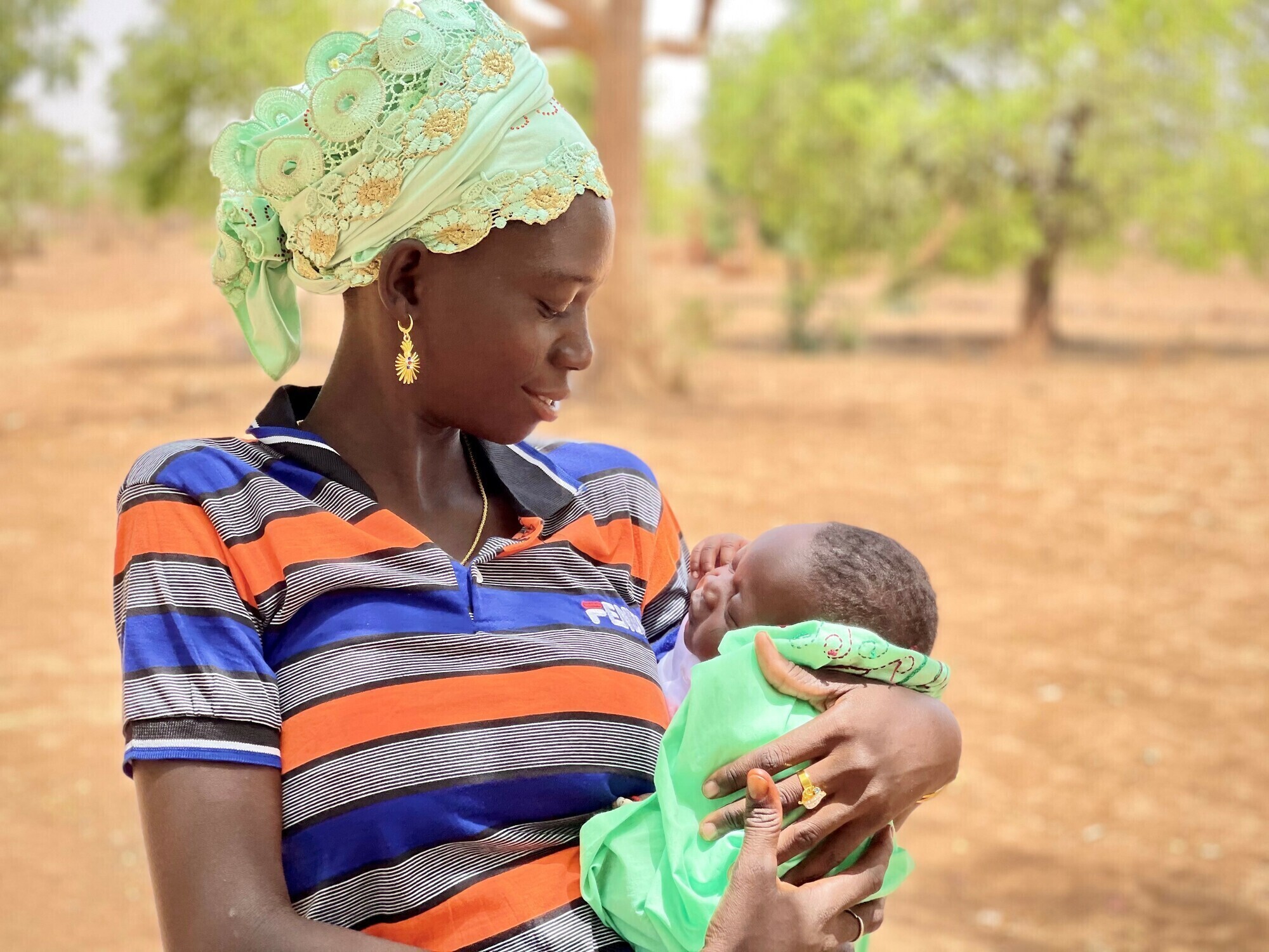 A mother holds her baby